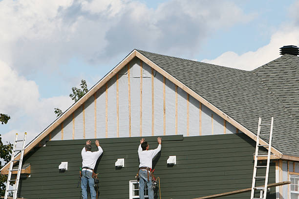 Professional Siding technician working in East Springfield, PA
